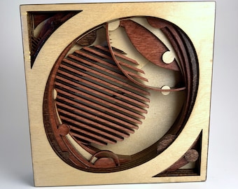 Obra de arte cortada con láser en madera / Intergaláctica