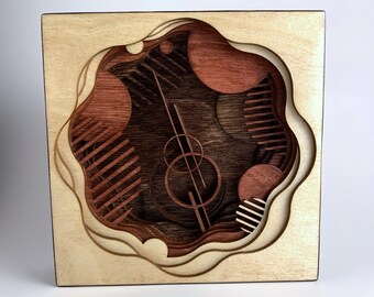 Obra de arte cortada con láser en madera / Portal orbital