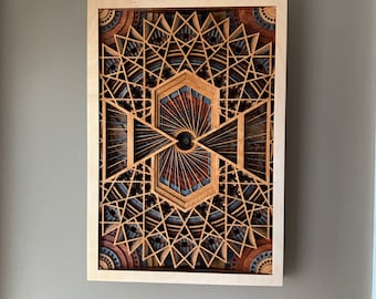 Obra de arte en madera cortada con láser / El ojo