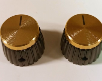 Ein Set von zwei Knöpfen - Antiker Vintage Verstärker, Gitarre oder Radio. Schwarz & Gold Farbe. Verwendet bei Marshall, Fender, Zenith, RCA und anderen.