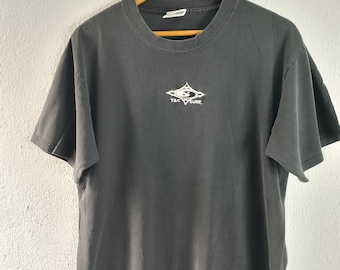 May include: Black t-shirt with a white logo that says "T&C Surf" in a diamond shape.