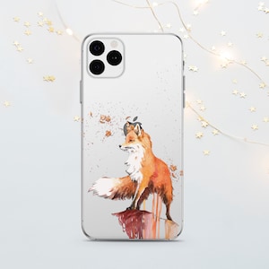 May include: A clear phone case featuring a watercolour illustration of a fox standing on a cliff. The fox is orange and white with a bushy tail. The background is a light blue with brown and orange watercolour splatters.