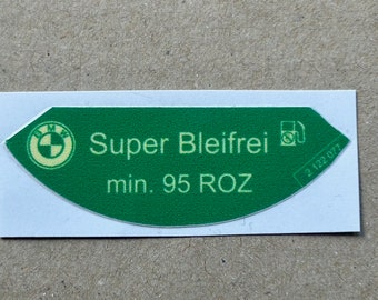May include: Green and white sticker with the BMW logo and the text "Super Bleifrei min. 95 ROZ".