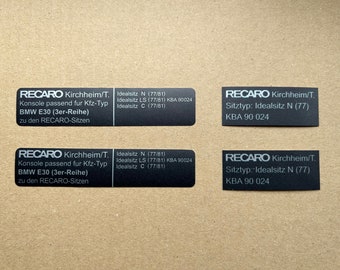 May include: Four black labels with white text. The labels are for RECARO car seats. The labels include the text "RECARO Kirchheim/T." and "Idealsitz N (77/81)" and "KBA 90 024".