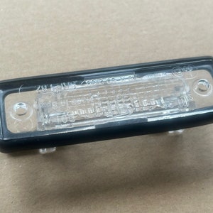 1x Lampada targa targa Hella BMW E30 E28 E24 E23 Z1 E12 Kennzeichenleuchte