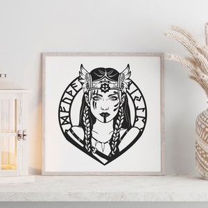 May include: Black and white illustration of a woman with a crown and wings, surrounded by a circle of runes. The text "Valkyrie" is written in runes around the circle.
