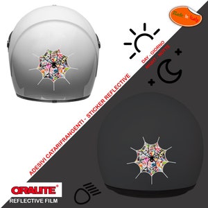 May include: A white motorcycle helmet with a reflective spider web sticker. The sticker is made of a reflective material that shines in the light. The sticker is also reflective at night. The helmet is made by Oralite and is made in Italy.