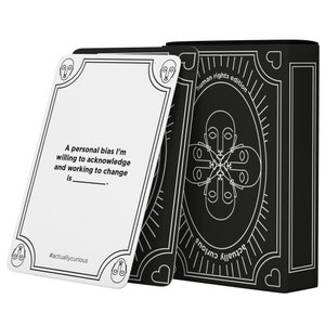 May include: A black and white card game box and cards. The box reads "human rights edition" and "actually curious". The cards have a white background with black text that reads "A personal bias I'm willing to acknowledge and working to change is..."