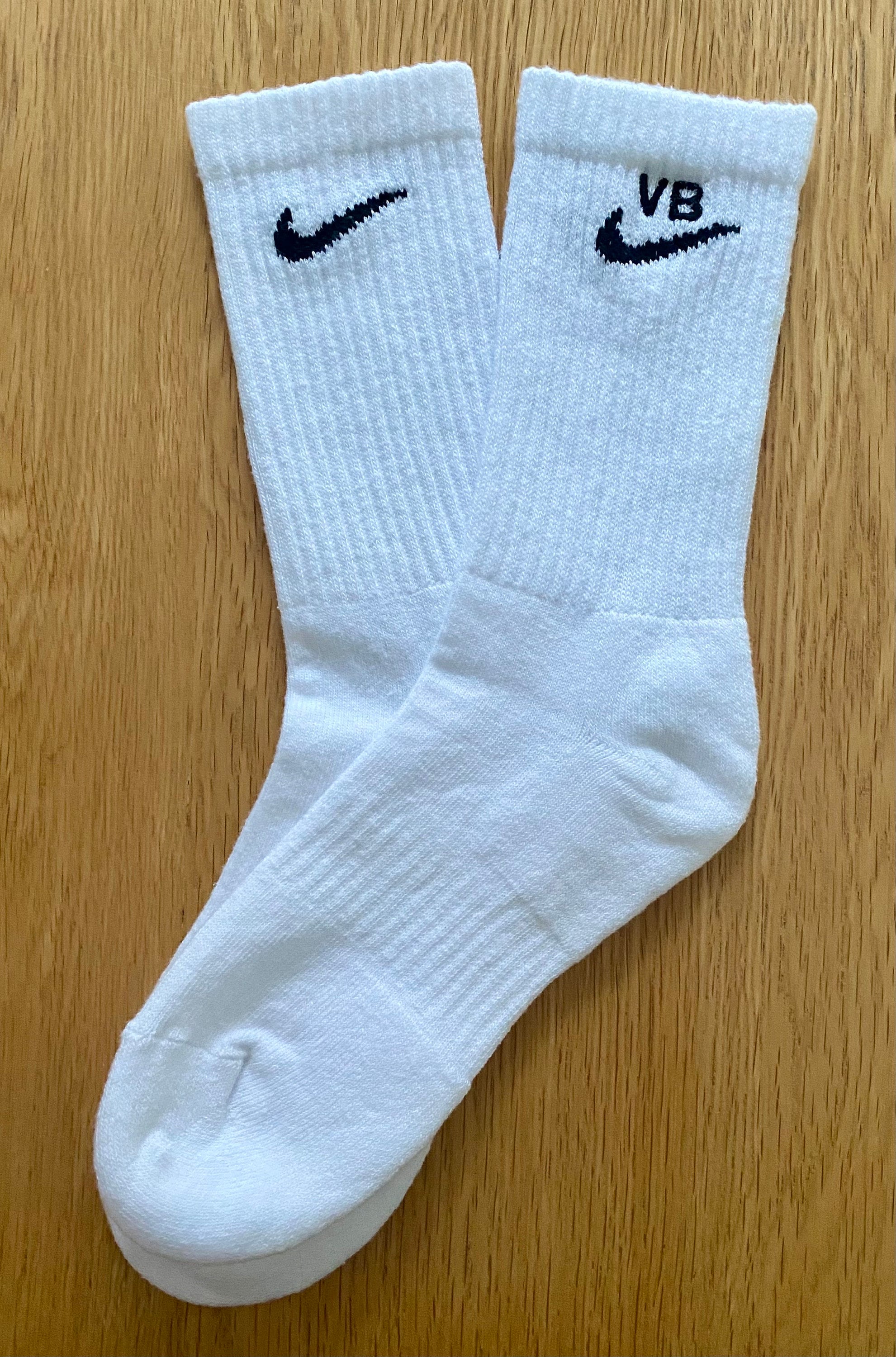 one pair of white nike socks