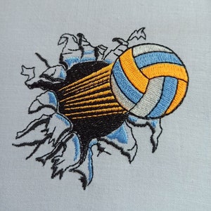 May include: Embroidered design of a volleyball breaking through a wall, with a black, blue, white, and orange color scheme.