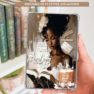 May include: A digital print featuring a woman reading a book, with text that reads "I am not a paperback, I am the hard copy." The image includes a candle and the text "Smells like smudges add character." The background is a bookshelf.