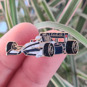 Formula One race car vintage enamel pin.
