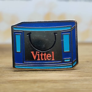 Vittel bottled water enamel pin badge. Vintage retro collectable advertising gift. Hat Tie Lapel scarf bag denim leather jacket accessorie