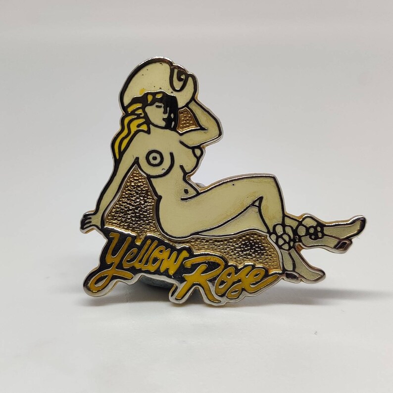 Yellow rose cow girl pin up nude Vintage enamel pin badge.