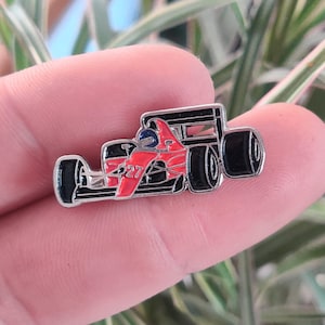 Formula One race car vintage enamel pin.