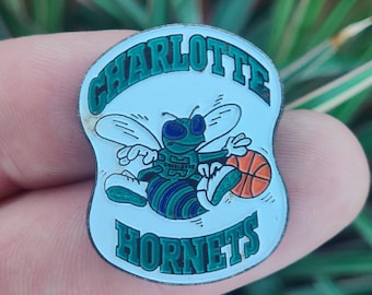 Charlotte Hornets NBA basketball enamel lapel pin badge.