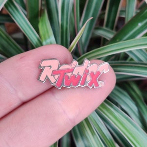 Twix vintage enamel lapel pin badge, Raider Twix chocolate bar pin.