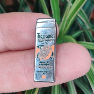 Tropicana vintage enamel lapel pin badge.