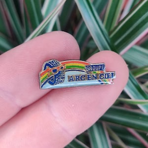 Groupe Arc en Ciel rainbow tyre sunglasses unusual weird vintage enamel lapel pin badge. image 1