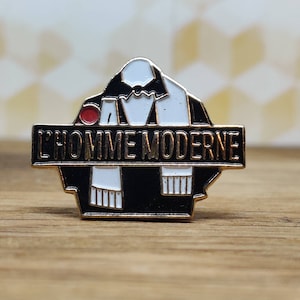 L' home moderne magazine catalogue enamel pin badge. Gimme moderne Hat tie scarf bag denim or leather jacket accessorie. Vintage retro