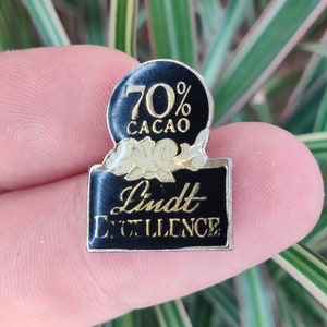 Lindt Chocolate vintage enamel lapel pin badge.