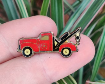 GMC Wrecker recovery truck vintage enamel lapel pin badge.