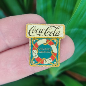Coca Cola welcome aboard vintage enamel pin badge.