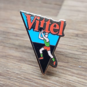Vittel bottled water enamel pin badge. Vintage retro collectable advertising gift. Hat Tie Lapel scarf bag denim leather jacket accessorie