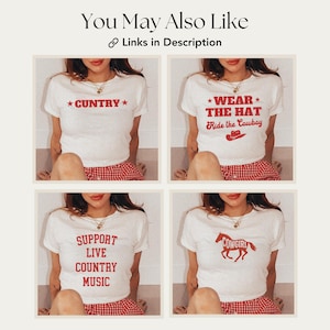 May include: Four white t-shirts with red text and graphics. The shirts feature the phrases "*COUNTRY*" , "*WEAR* THE HAT Ride the Cowboy", "SUPPORT LIVE COUNTRY MUSIC", and "COWGIRL".