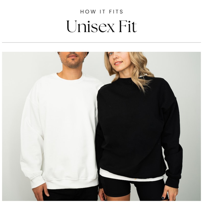 May include: Two people wearing sweatshirts, one white and one black, with the text "Unisex Fit" above them.