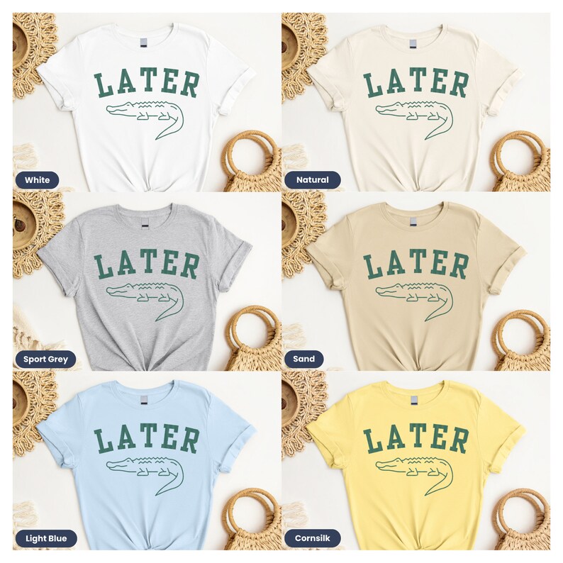 May include: Five different color t-shirts with the text "LATER" and a green alligator graphic. The colors are white, natural, sport grey, sand, and light blue.