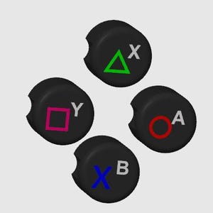 May include: Four black round buttons with different colored symbols. The buttons are labeled with the letters X, Y, A, and B. The symbols are a triangle, a square, a circle, and an X.