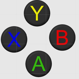 May include: Four black buttons with white letters on them. The buttons are arranged in a square pattern. The letters are X, Y, A, and B. The letters are in blue, yellow, green, and red.