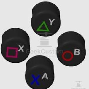 以下が含まれることがあります： 異なるシンボルと文字が描かれた4つの黒い円形コントローラーボタン。上のボタンには緑色の三角形と文字Yが表示されています。左のボタンにはピンク色の四角形と文字Xが表示されています。右のボタンには赤色の円と文字Bが表示されています。下のボタンには青色のXと文字Aが表示されています。