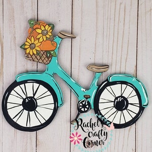 Bicicleta de otoño con girasoles y calabazas Cartel de percha de puerta