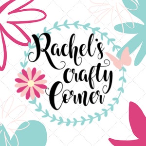 May include: A white background with a blue and green floral wreath. The text "Rachel's Crafty Corner" is in black cursive lettering inside the wreath. A pink butterfly is to the right of the text.