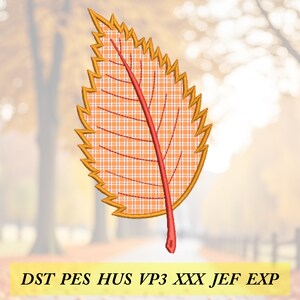 May include: An embroidered leaf design with a plaid pattern in shades of orange and yellow. The leaf has a red central vein and a jagged, golden-yellow border. The image includes the text "DST PES HUS VP3 XXX JEF EXP".