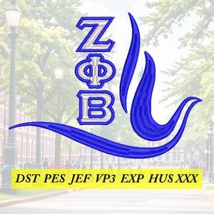 Può includere: Un disegno per ricamo che presenta le lettere greche Zeta Phi Beta in filo blu e bianco, accompagnato da un elemento grafico blu a forma di curva. Sotto il disegno, il testo recita: DST PES JEF VP3 EXP HUS XXX.