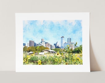 May include: A watercolor painting of a city skyline with tall buildings and a blue sky. The foreground features a field of yellow sunflowers in bloom.