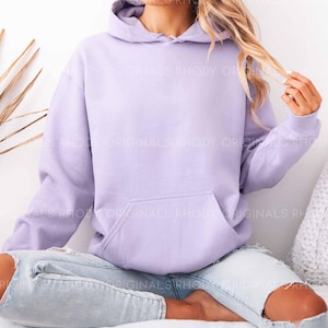 May include: A lavender colored hoodie with a drawstring hood. The hoodie is made of a soft, comfortable fabric and has a relaxed fit.