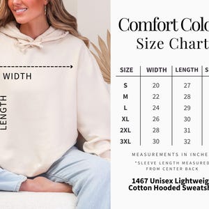 May include: Cream-colored unisex lightweight cotton hooded sweatshirt. The image includes a size chart with measurements in inches for width, length, and sleeve length. The text on the image reads "Comfort Colors Size Chart."