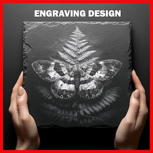 May include: A square, black slate coaster with an engraved design of a moth and fern. The moth has detailed wing patterns in shades of white and gray. The text "ENGRAVING DESIGN" is at the top.