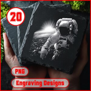 May include: Four square, dark grey slate coasters are stacked. Each coaster has a black and white image of an astronaut in space with the sun rising over Earth. The text "Engraving Designs" and "PNG" are visible.