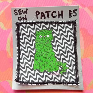 Parche de tela de gato de limo en la espalda