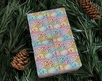 Papel de regalo con estampado de donuts en tonos pastel