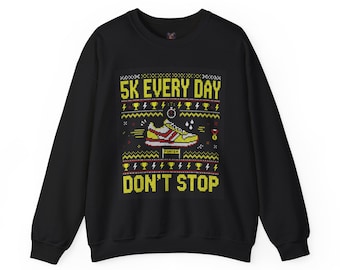 May include: A black crewneck sweatshirt featuring a graphic print with the yellow text 5K EVERY DAY and DON'T STOP. The design includes a pixelated yellow and red running shoe, trophies, lightning bolts, and a finish line banner.