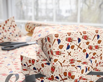 May include: Wrapping paper featuring a repeating pattern of baseballs, brown leather gloves, wooden bats, blue baseball caps, and iced coffee cups with red straws on a cream background. The paper is used to wrap two rectangular boxes.