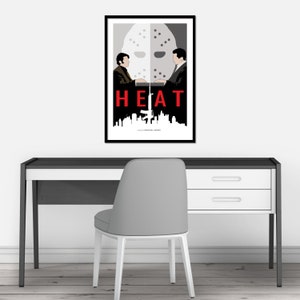 May include: A minimalist poster design for the film "HEAT" featuring a black and white silhouette of two men facing each other with a hockey mask between them. The title "HEAT" is in red text and the film's director, Michael Mann, is credited at the bottom.