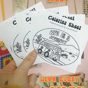 May include: A hand holding several white coloring sheets with a black and white illustration of a van, cacti, and the text "LIFE IS A JOURNEY". The sheets are labeled "Coloring Sheet" and "original artwork by Louisenkind". The image also includes the text "FREE COLORING SHEET" and "WITH EVERY ORDER!"