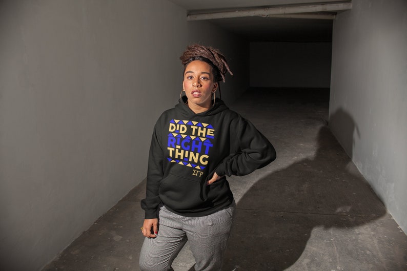 May include: A black hooded sweatshirt with a gold and blue graphic print that says "Did the Right Thing" and "&Sigma;&Tau;&Rho;".